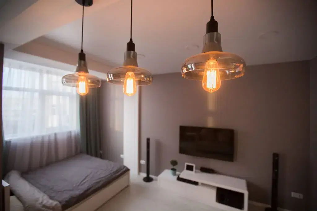Warm light fixtures in modern room