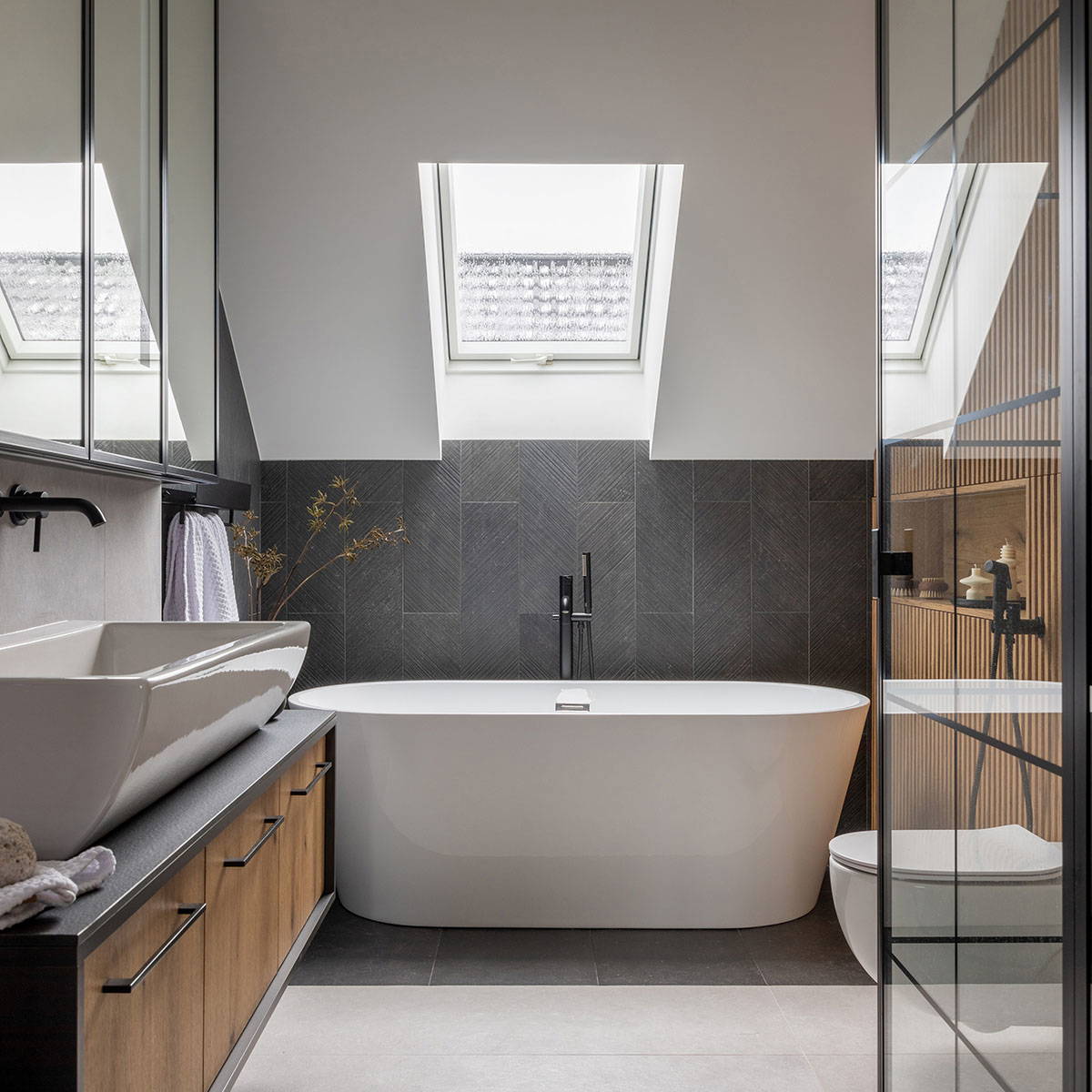 Modern bathroom with skylights and elegance.