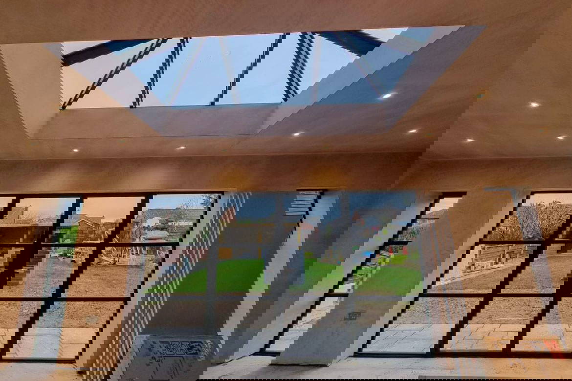 Modern room with large skylight and garden