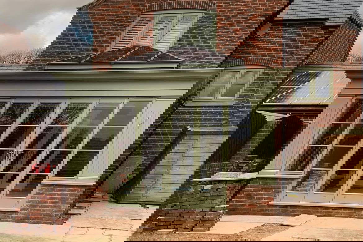 Modern conservatory with green frame