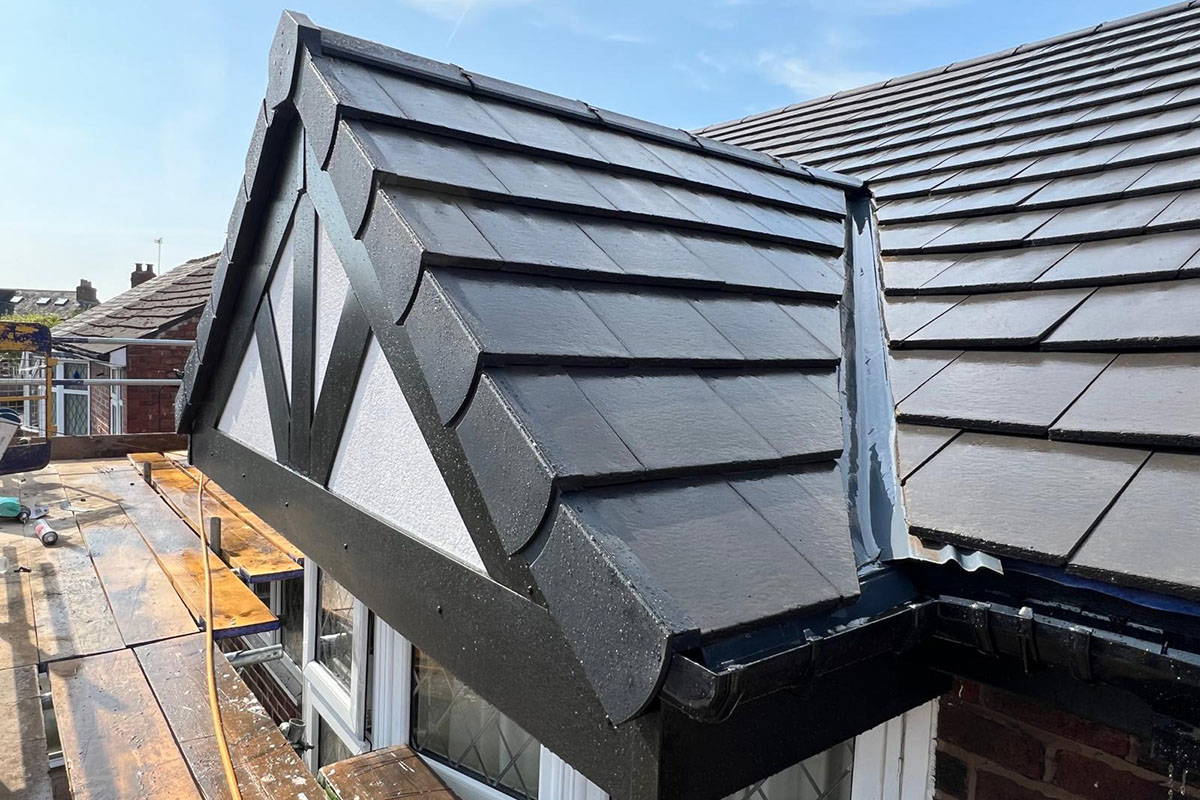 Newly installed black tiled roof