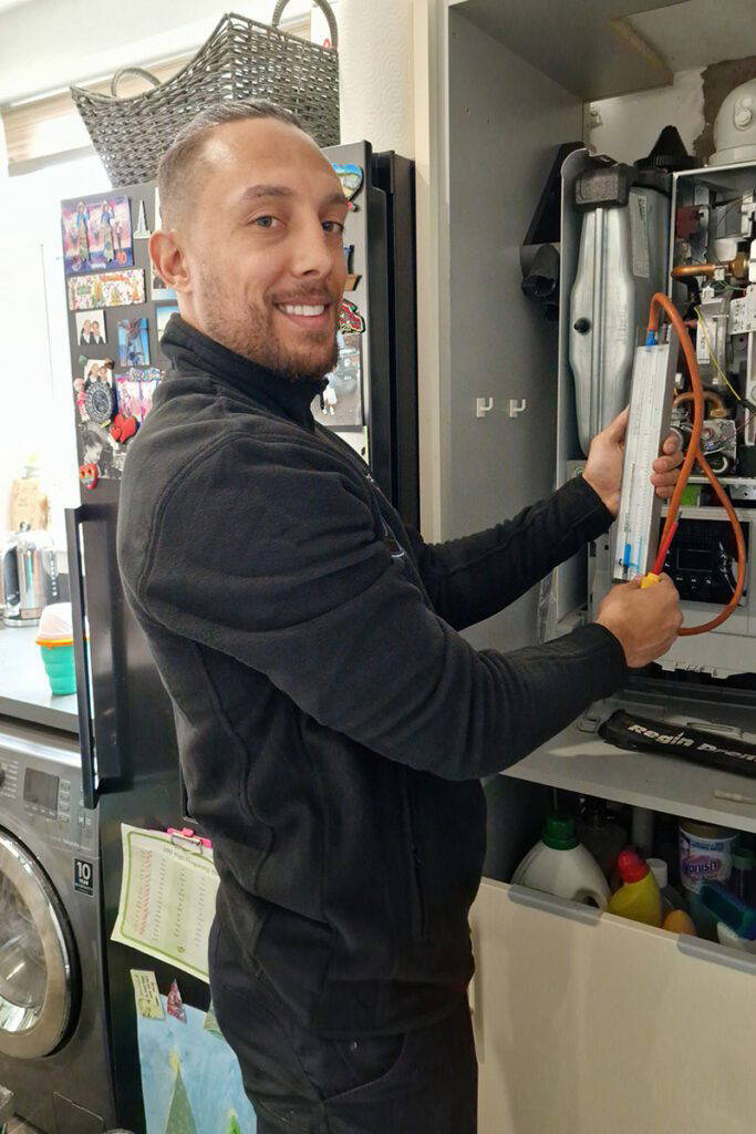 Technician servicing a domestic appliance.