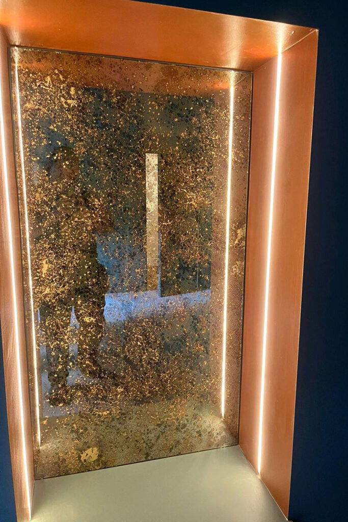 Illuminated door with metallic finish.