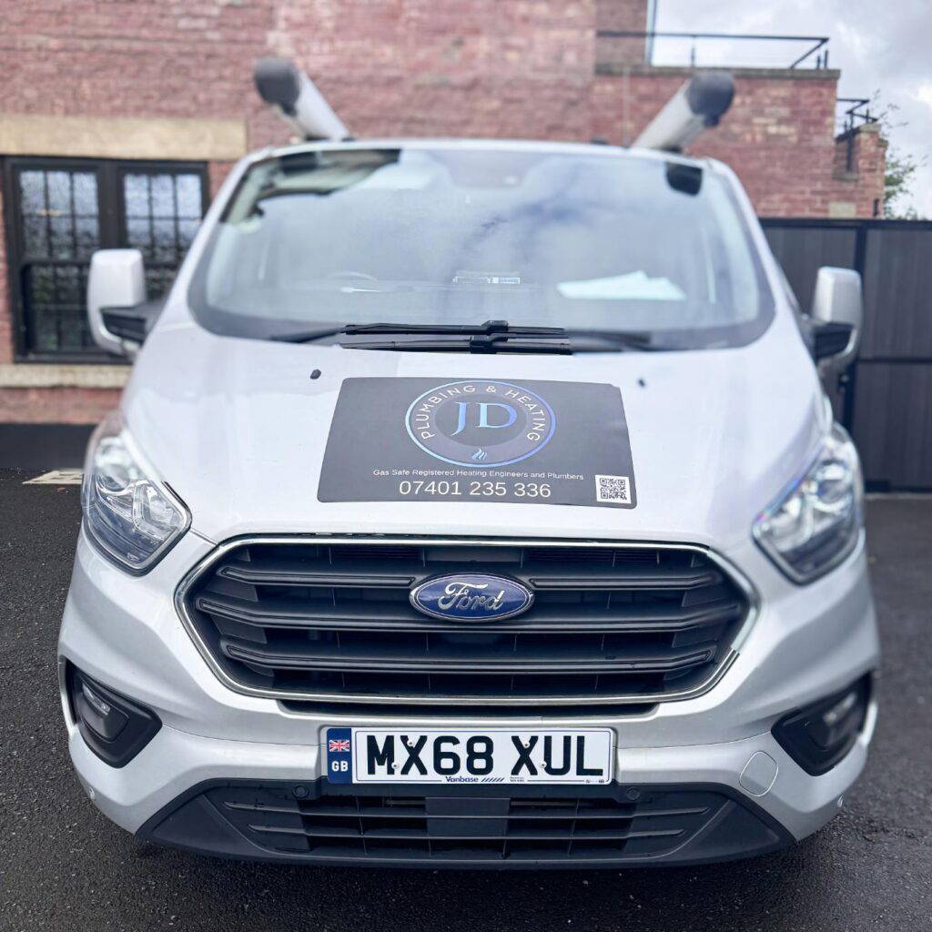 Silver Ford van with company branding