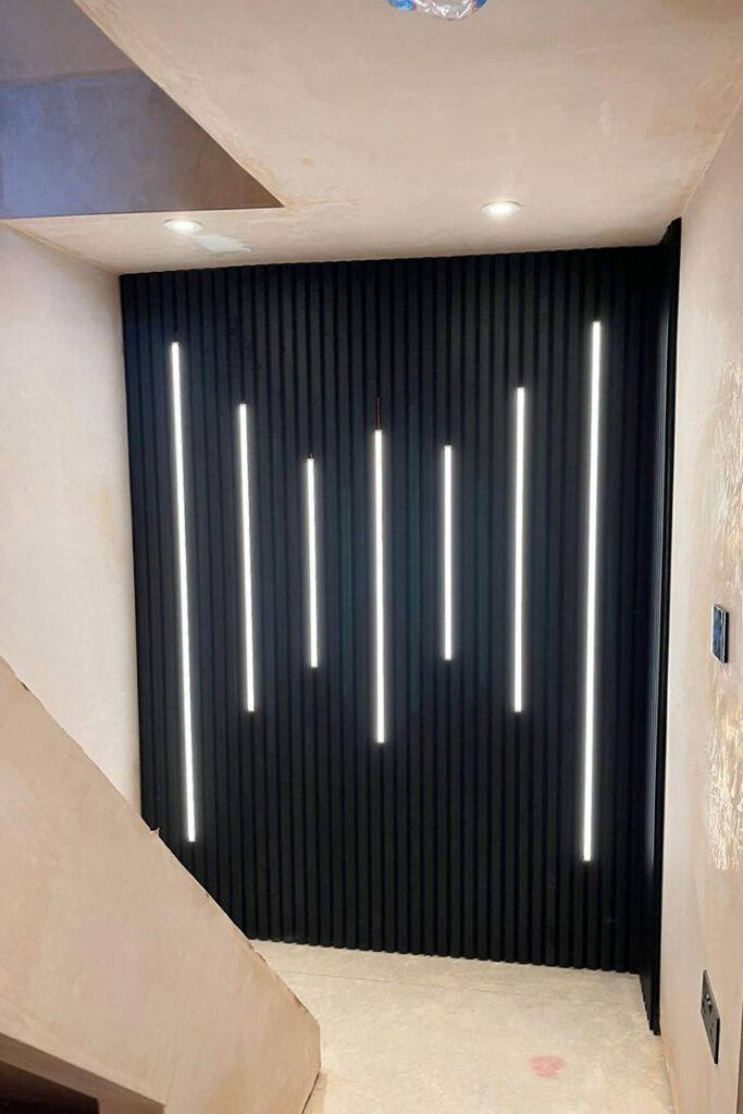 Modern black wall with vertical lights