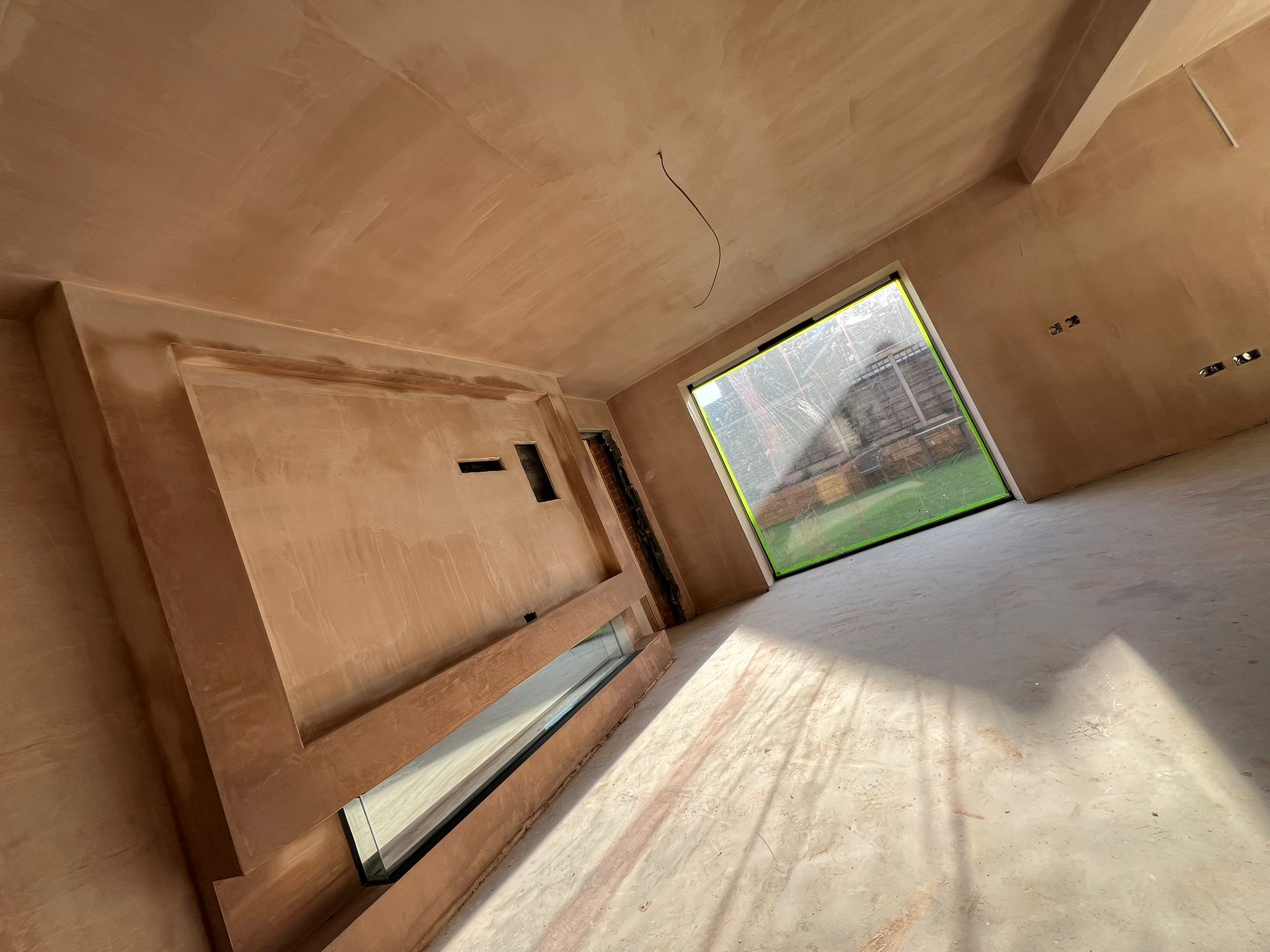 Freshly plastered interior with large window