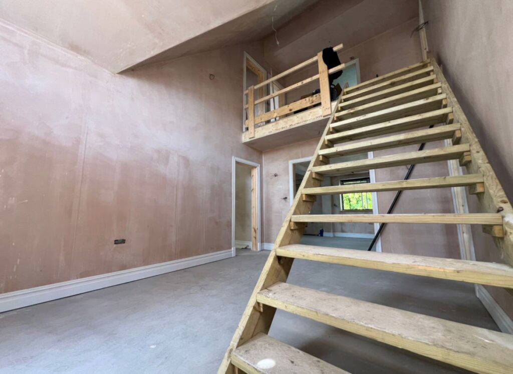 Empty room with wooden staircase