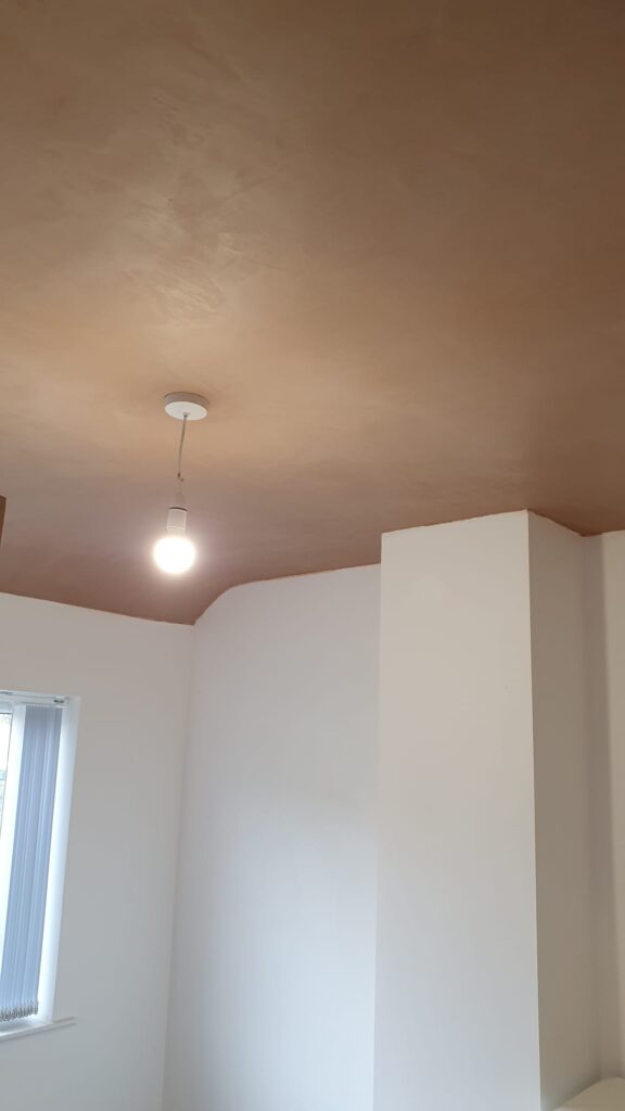 Freshly plastered ceiling with light